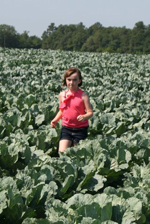 Mary Grace in her Daddy's collards field.