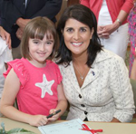 Mary Grace with Governor Haley as she signs S. 823 into law on June 2, 2011.